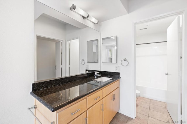 full bathroom with vanity, tile patterned floors, ceiling fan, toilet, and tub / shower combination