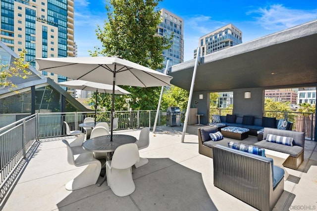 view of patio with outdoor lounge area and area for grilling