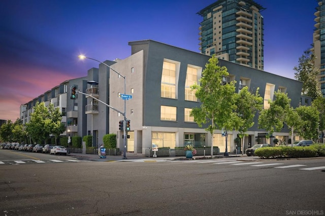 view of outdoor building at dusk