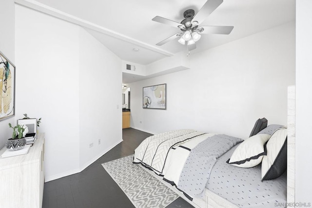 bedroom with ceiling fan and dark hardwood / wood-style floors