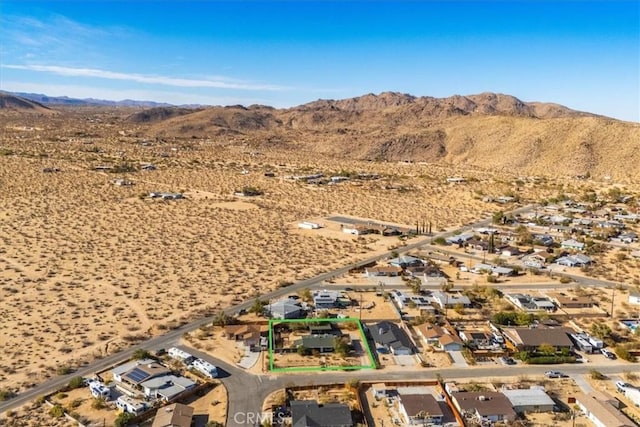 birds eye view of property featuring a mountain view