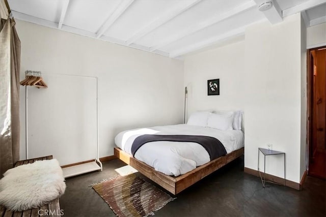 bedroom featuring beam ceiling