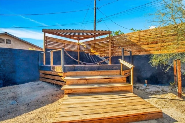 wooden deck with an outdoor structure