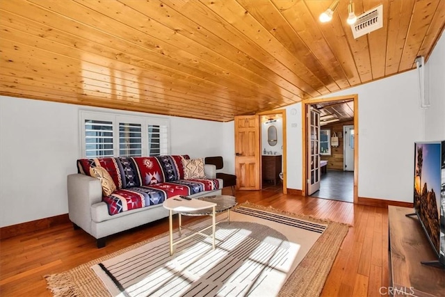 living room featuring wooden ceiling, lofted ceiling, and hardwood / wood-style flooring