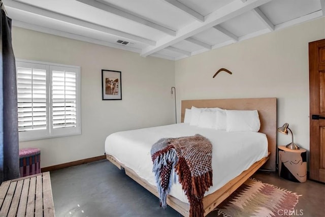 bedroom with beam ceiling