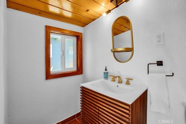 bathroom with vanity and wooden ceiling