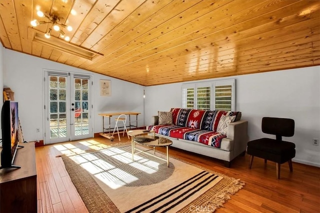 living room with french doors, wooden ceiling, a notable chandelier, lofted ceiling, and hardwood / wood-style flooring