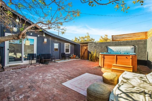 view of patio featuring a hot tub