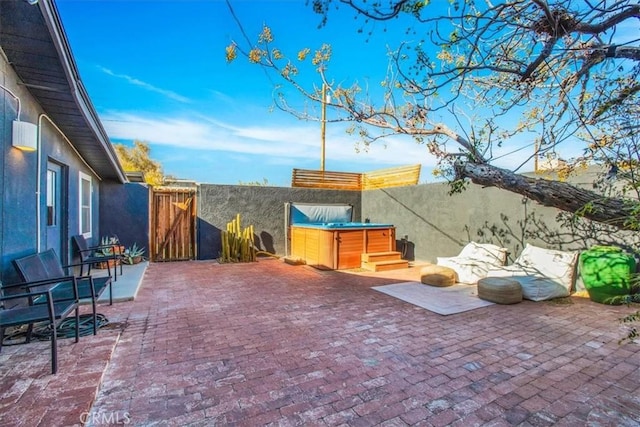 view of patio featuring a hot tub