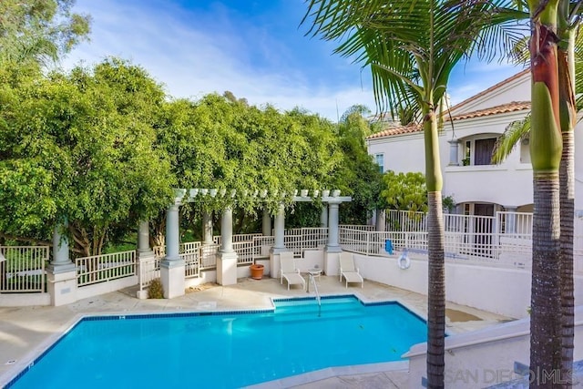 view of swimming pool featuring a pergola