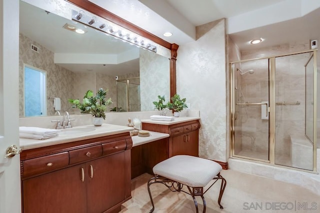 bathroom featuring walk in shower and vanity