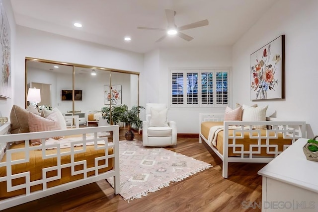 bedroom with hardwood / wood-style flooring and a closet