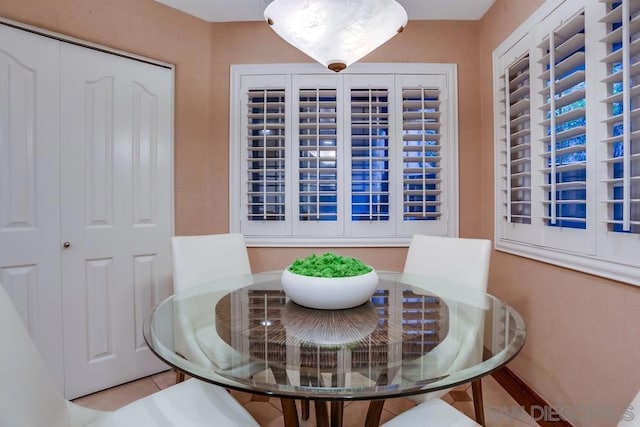 dining area featuring light tile patterned floors