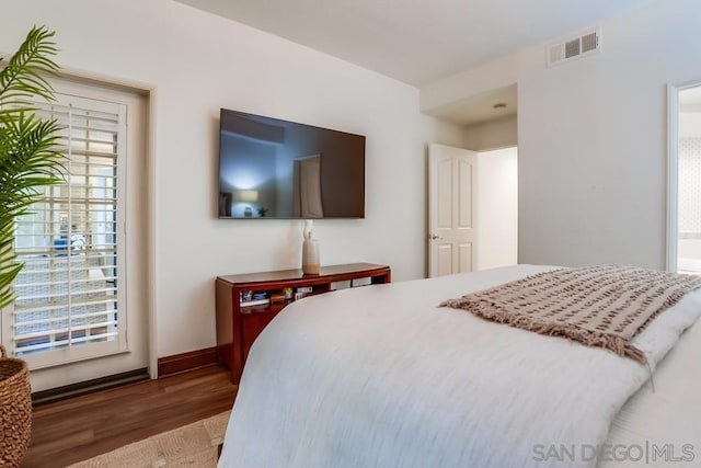 bedroom with hardwood / wood-style floors