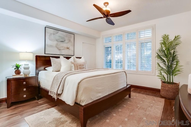 bedroom featuring ceiling fan and light hardwood / wood-style floors