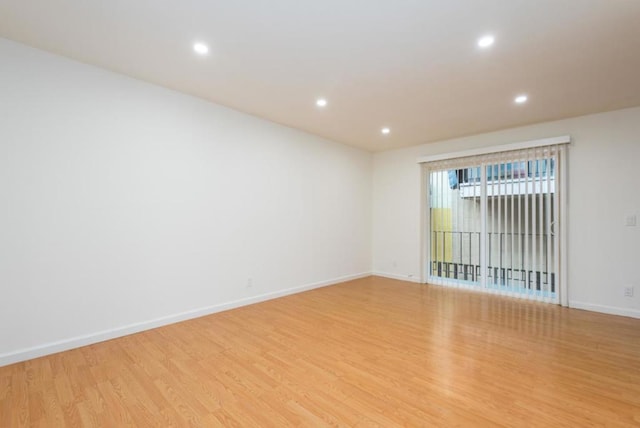 spare room featuring light wood-type flooring