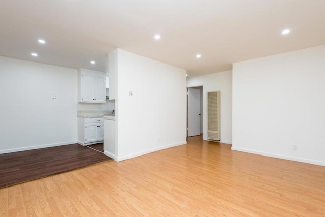 unfurnished living room with light wood-type flooring