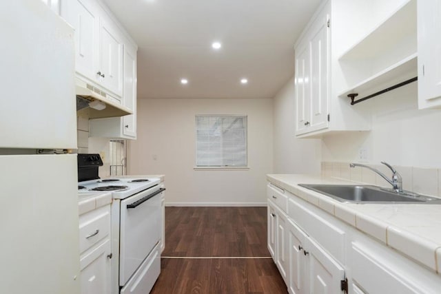 kitchen with dark hardwood / wood-style floors, white cabinetry, sink, and white appliances