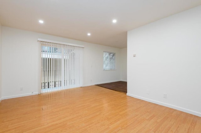 spare room with light hardwood / wood-style floors