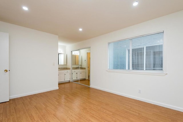 spare room featuring light hardwood / wood-style flooring