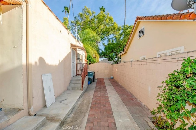 view of side of home featuring a patio area