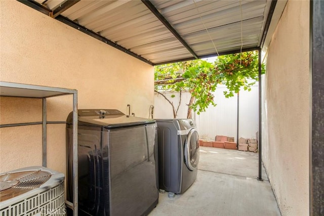 laundry room featuring washing machine and clothes dryer