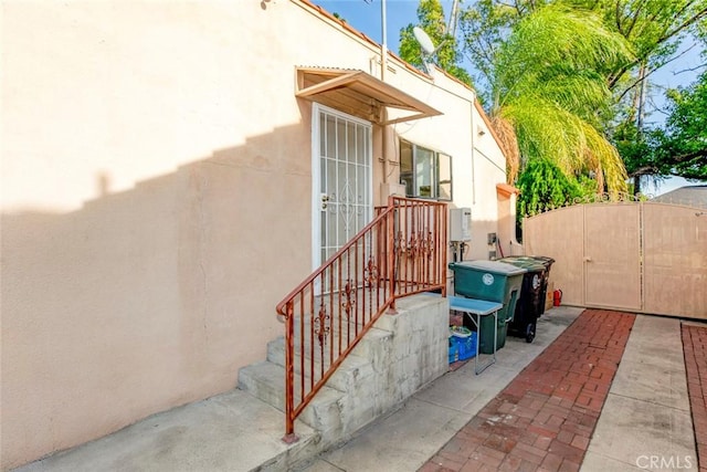 view of side of home featuring a patio area