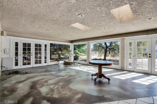 unfurnished sunroom with french doors