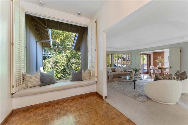 doorway to outside featuring a wealth of natural light and parquet floors