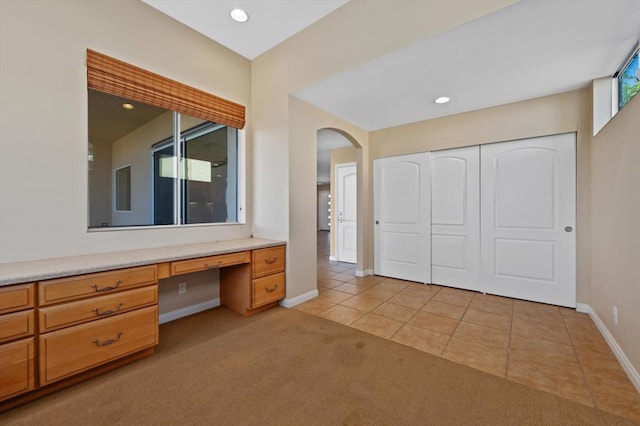 bathroom with tile patterned floors and vanity