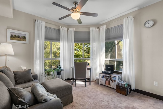 living room featuring light carpet and ceiling fan