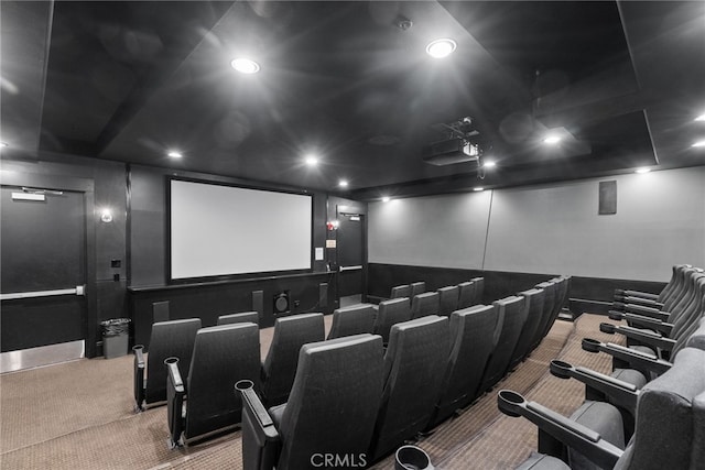 cinema room featuring carpet flooring