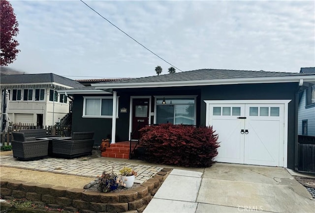 rear view of property with a garage