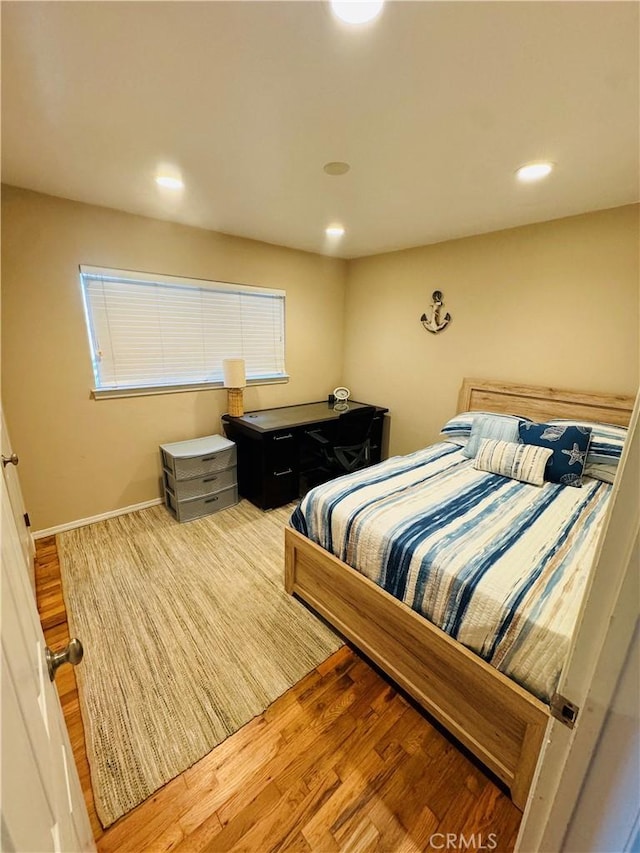 bedroom with wood-type flooring