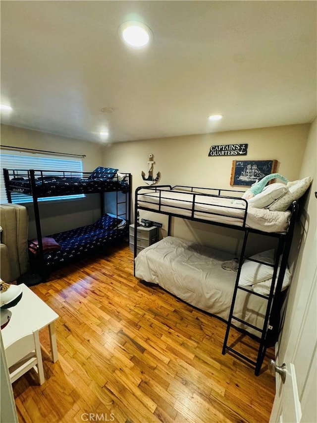 bedroom with wood-type flooring