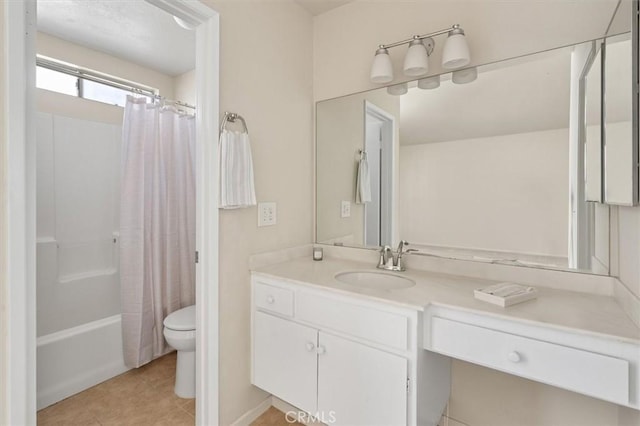 full bathroom with shower / tub combo with curtain, vanity, tile patterned flooring, and toilet