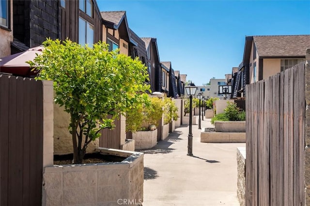 surrounding community featuring a residential view, a patio, and a fenced backyard