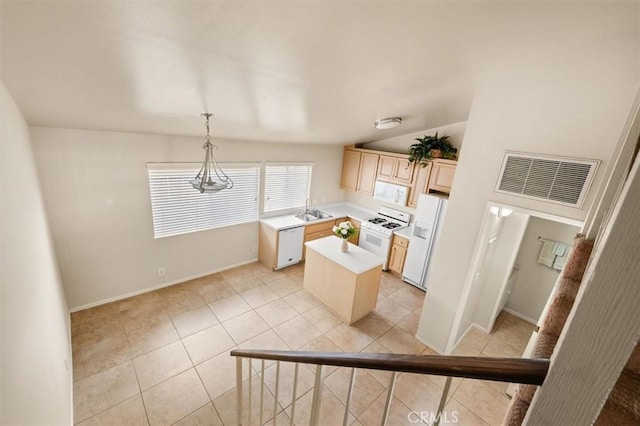 kitchen featuring lofted ceiling, sink, white appliances, hanging light fixtures, and a center island