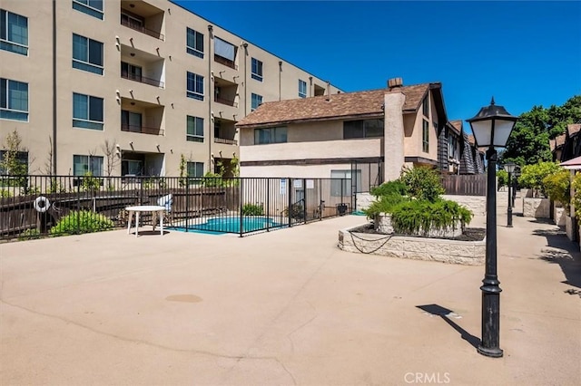 view of swimming pool featuring a patio area