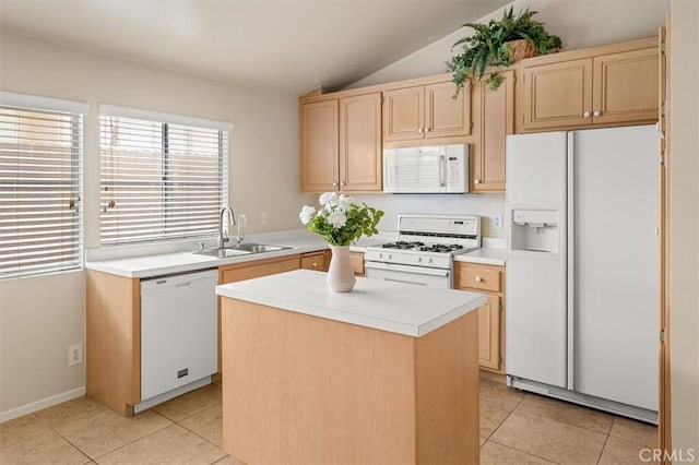 kitchen featuring lofted ceiling, sink, a center island, light tile patterned floors, and white appliances