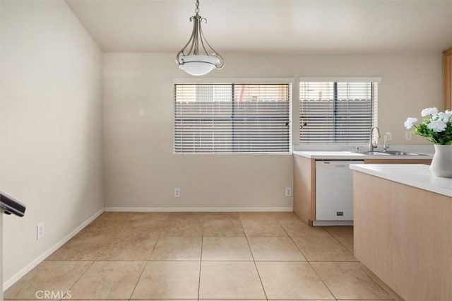 unfurnished dining area featuring sink and light tile patterned floors