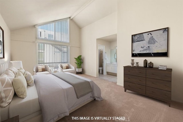 carpeted bedroom with connected bathroom and high vaulted ceiling