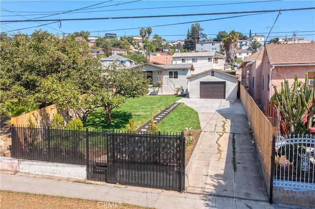 view of front of house with a detached garage, fence, and stucco siding