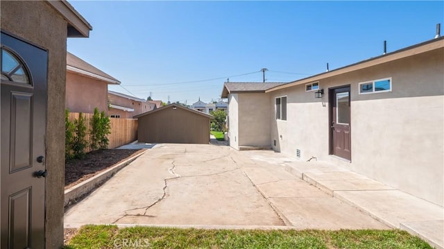 view of patio / terrace featuring fence