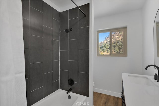 bathroom featuring shower / tub combo, vanity, and hardwood / wood-style flooring