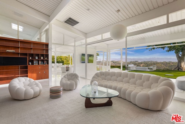 living room with beamed ceiling