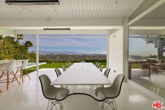 sunroom / solarium with a mountain view