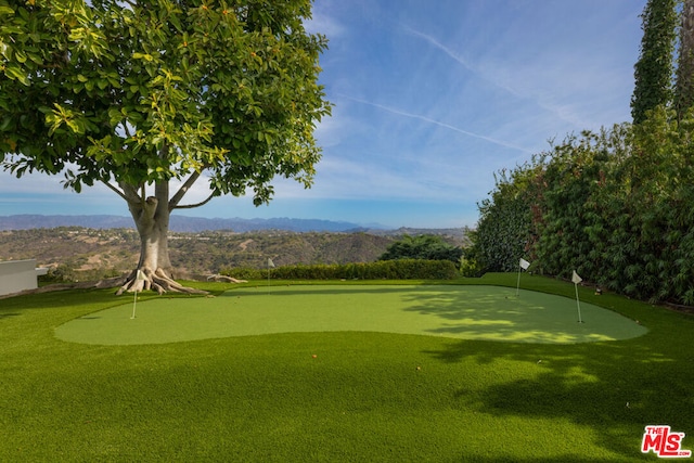 surrounding community with a mountain view