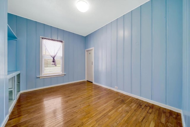 empty room featuring hardwood / wood-style floors