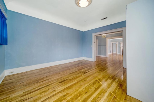 unfurnished room with light hardwood / wood-style floors